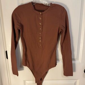 Brown body suit